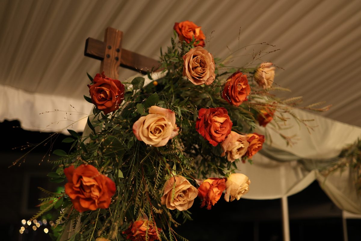 Fall wedding arch with romantic floral design
