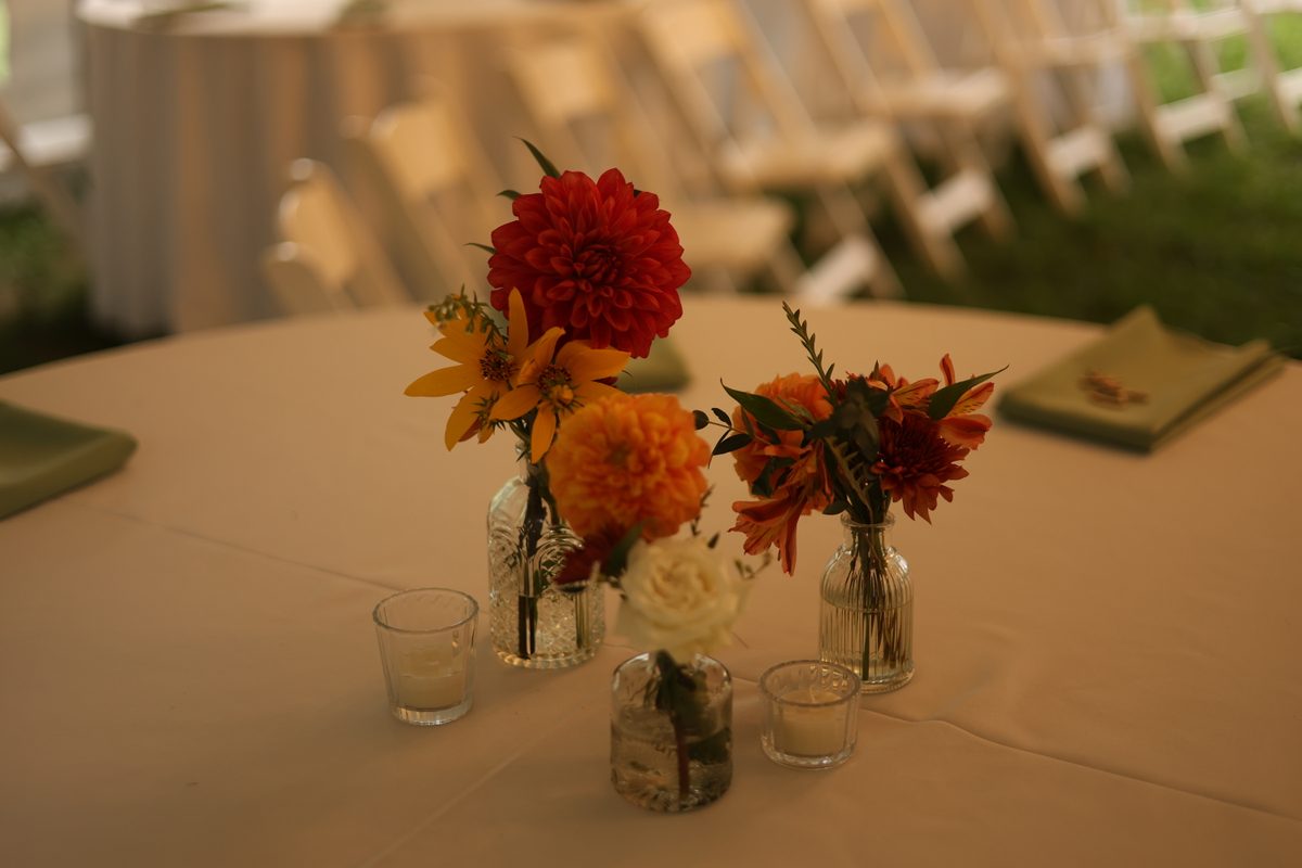 Fall wedding tablescape with warm-toned arrangements