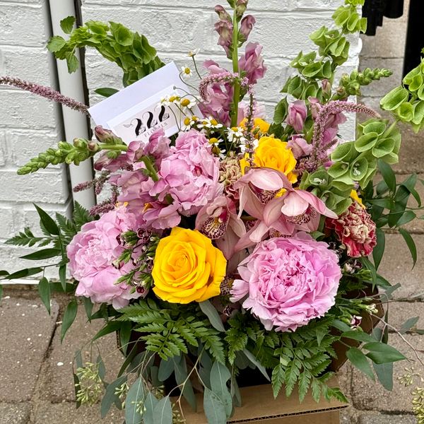 Pink peonies and yellow roses