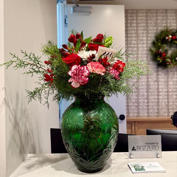 Holiday arrangement in green vase