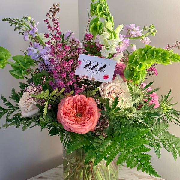 Spring garden roses and ferns